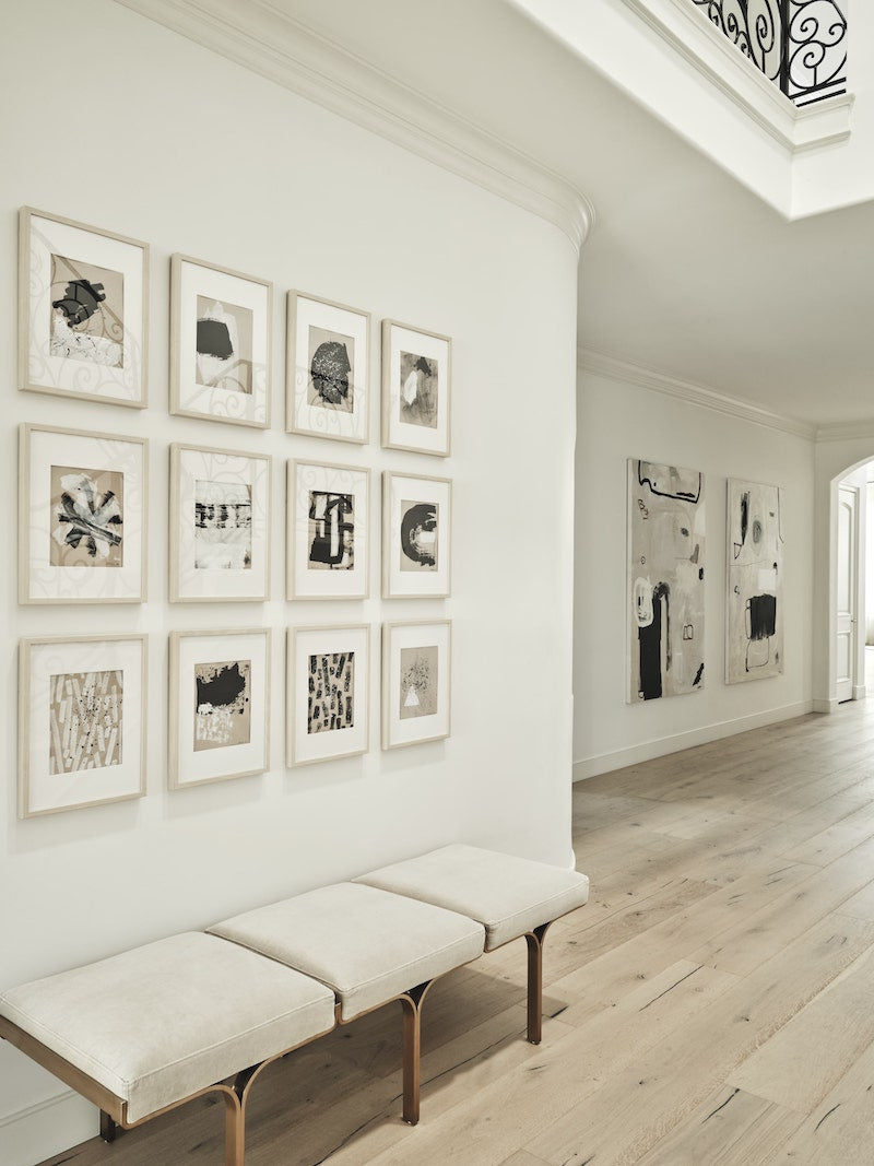 Hallway With Many Small Art Pieces Hanging On The Walls