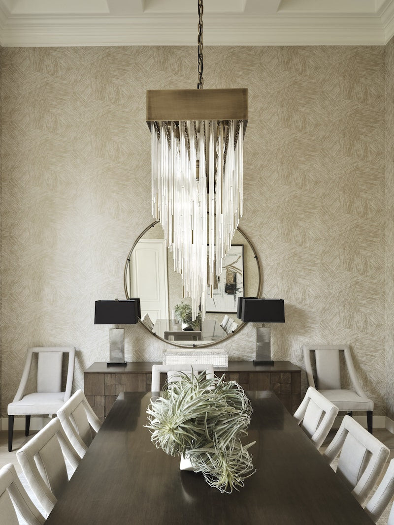 Large Dining Table And A Crystal Light Fixture Above It