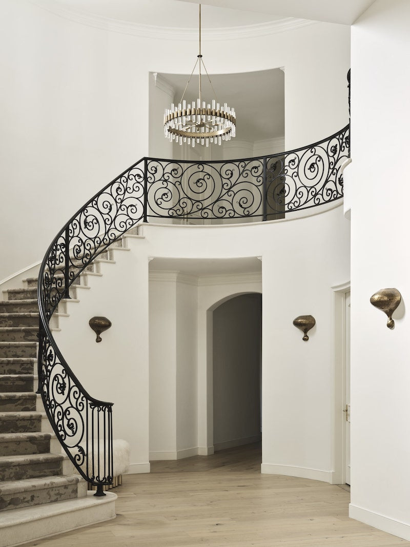 Marble Staircase With A Black Handrail