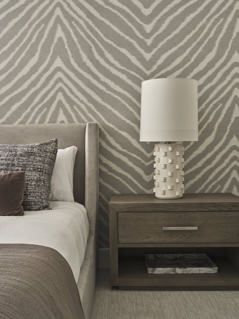 Dark Gray Night Stand Next To A Bed