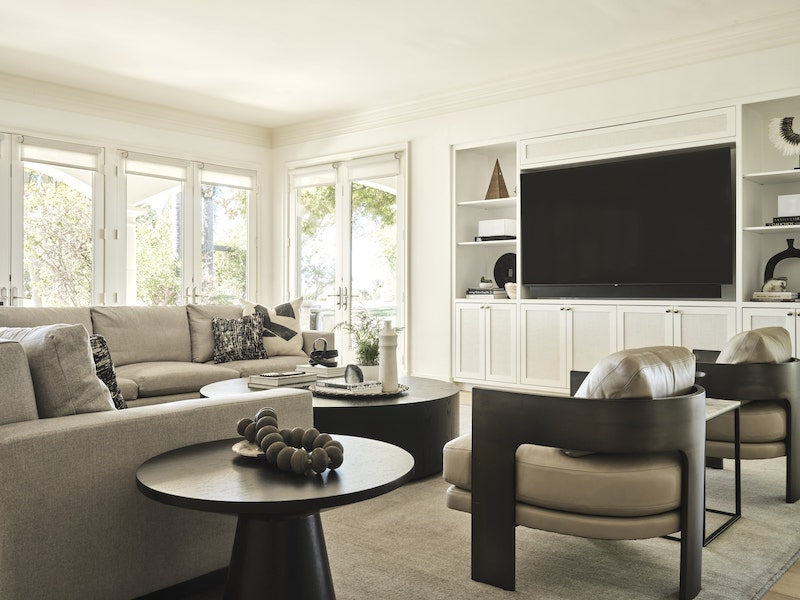 Living Room With A Large TV Next To A Couch