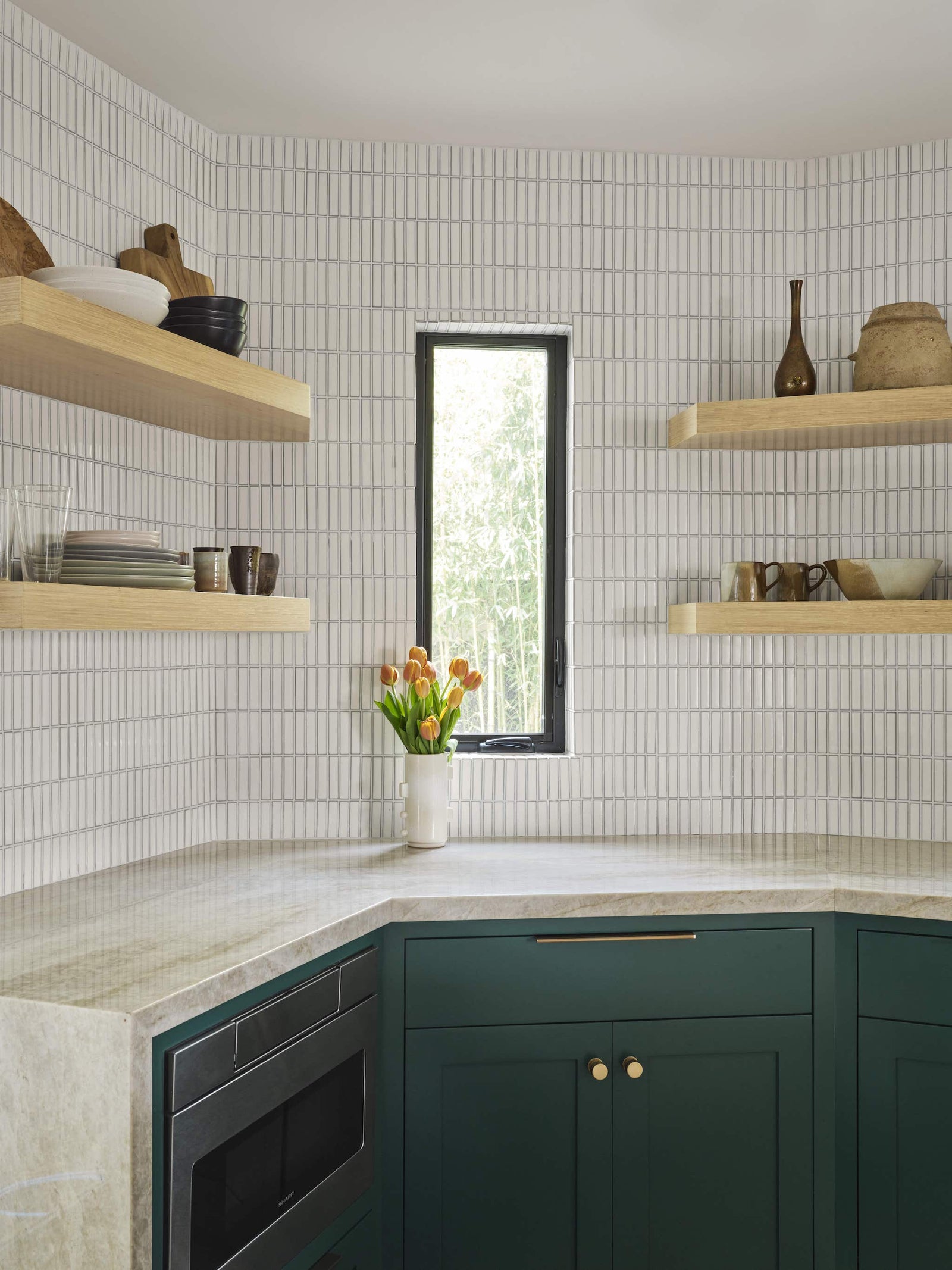 Kitchen Corner View With A Window And a Plant