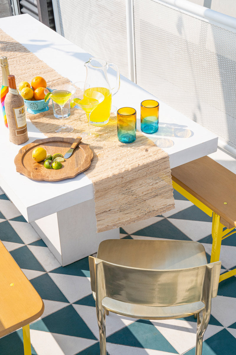 Outside Dining Table With Lemonade And Lemons On it