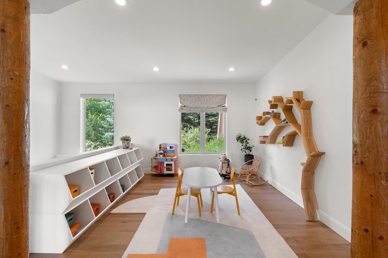 Childrens Play Room With White Walls And Wooden Elements