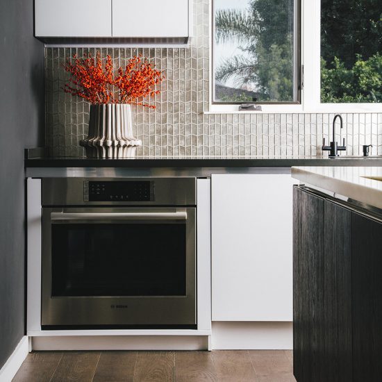 Red Flowers In A Dark Kitchen