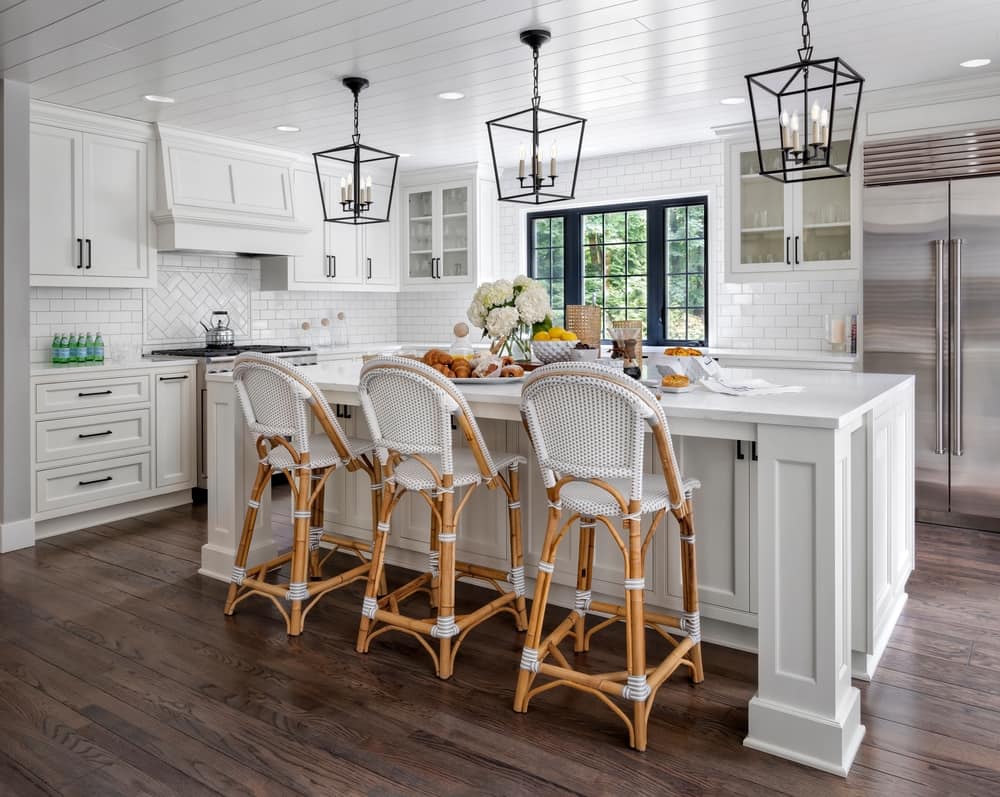 Kitchen With White Countertops and White Chairs